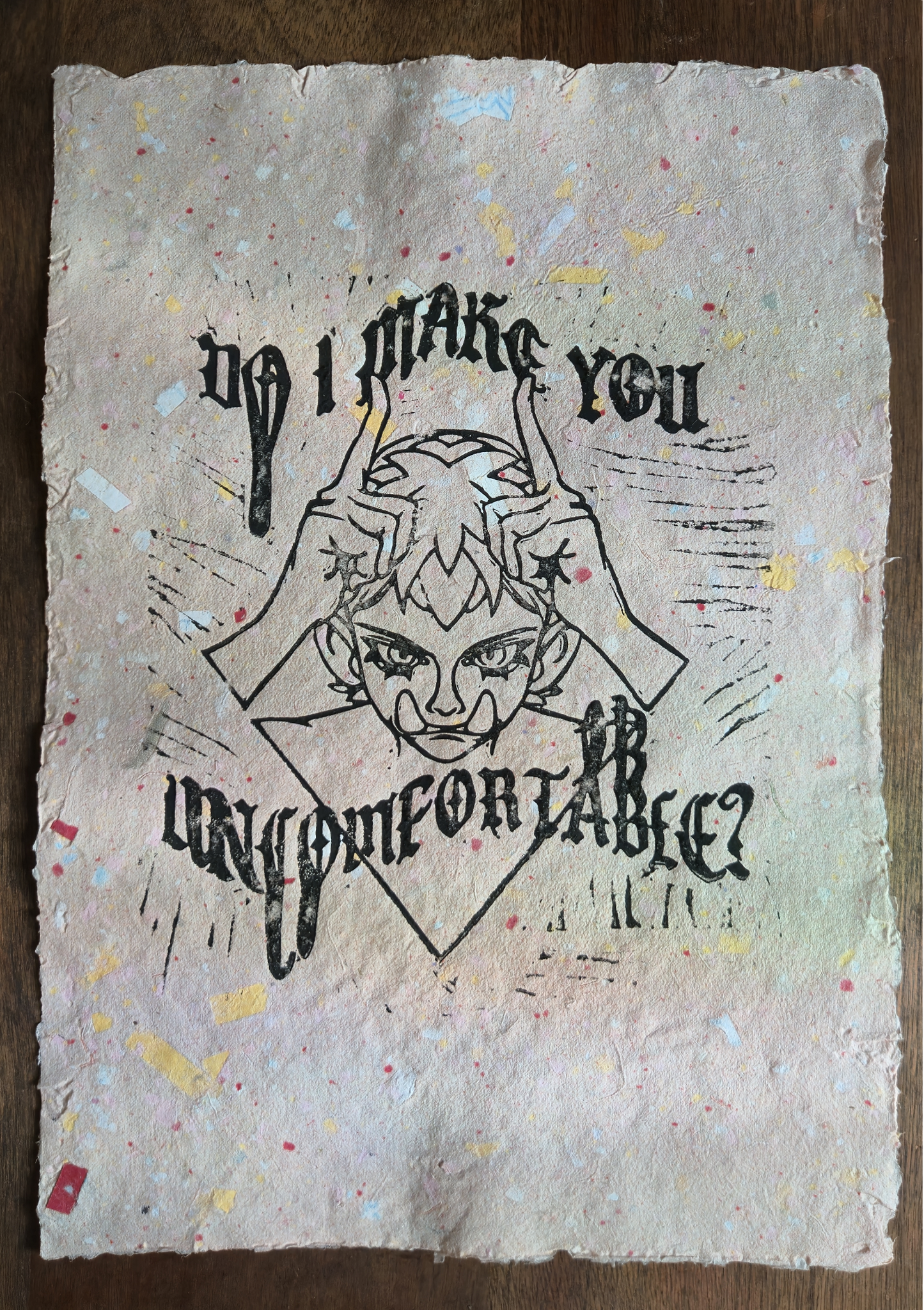 Uncomfy linocut print, black on signature pink confetti paper