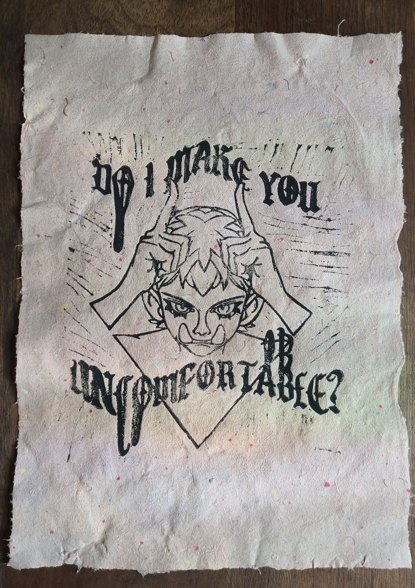 Uncomfy linocut print, black on signature pink confetti paper