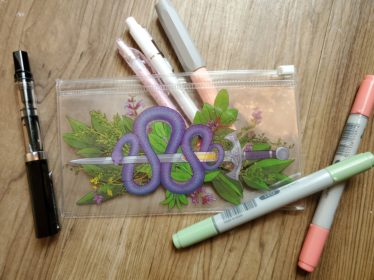 Snake and sword vinyl pouches