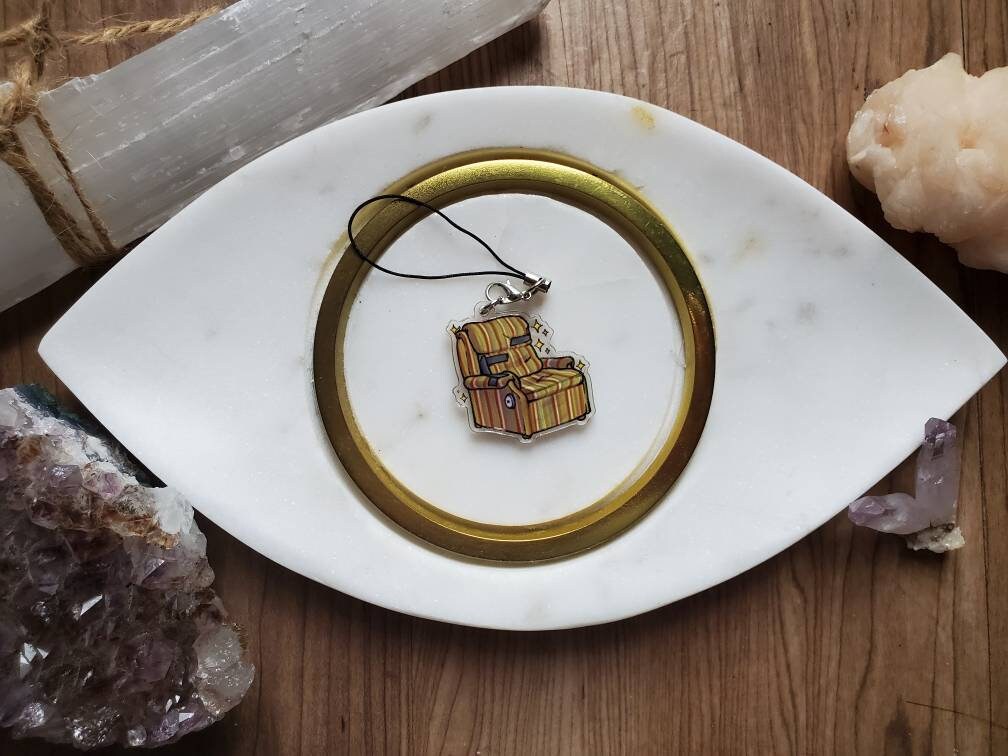 An acrylic charm of Martin's chair from the hit tv show Frasier